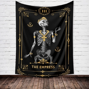 Close-up of gothic tarot tapestry featuring III The Empress skeleton design on white wall
