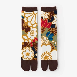 Detailed pattern of Japanese tabi split toe socks featuring vintage floral patchwork