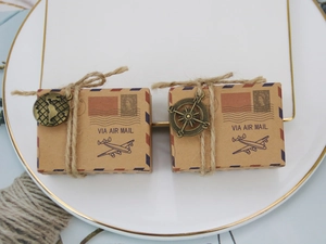 Vintage kraft paper candy boxes with aviation mail design and metal compass charms