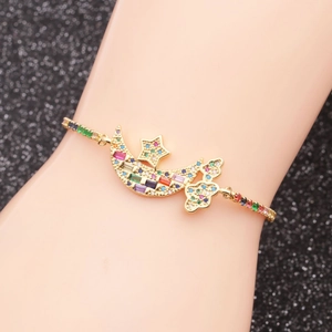 Adjustable gold moon and star bracelet with multi-colored cubic zirconia gems