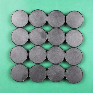 Detailed top view of 16 pieces of matte black round DIY craft and model bases