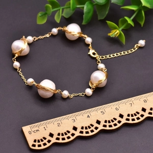 Handmade natural freshwater pearl bracelet with gold wire wrapping and sizing ruler