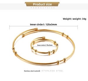 Detail view of gold cable wire choker and bangle set with sizes and bead accents
