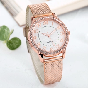 Elegant rose gold women's quartz watch with rhinestone bezel and metal mesh strap