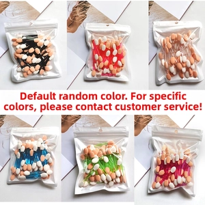 Macro view of assorted colorful disposable dual-sided sponge eyeshadow applicators