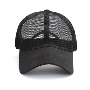 Close-up of black breathable mesh trucker hat showing high-quality stitching and fabric