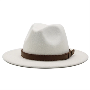 Close-up of a white wool jazz fedora hat with a brown braided synthetic leather band
