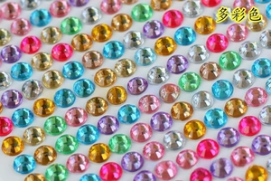 Detailed view of colorful 3mm round acrylic rhinestones with faceted cut surfaces