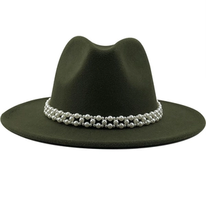 Close-up of a dark green wool jazz hat featuring an elegant white pearl beaded band