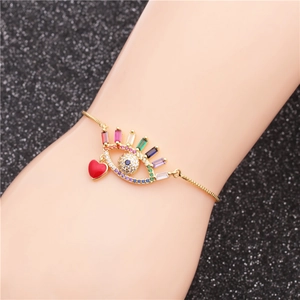 Gold evil eye bracelet with multicolored zircons and red heart pendant for women