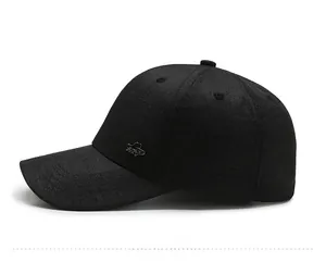 Side view of dark grey baseball cap showing textured fabric and silver metallic logo