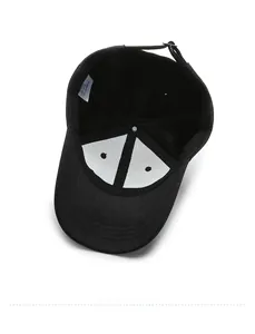 Interior detail of black cotton baseball cap showing sweatband and adjustable buckle