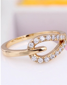 Macro shot of 18K gold plated ring featuring sparkling zircon stones on a ring band
