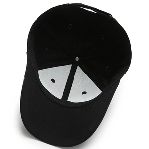 Inside view of black cotton baseball cap showing structural support and seam stitching