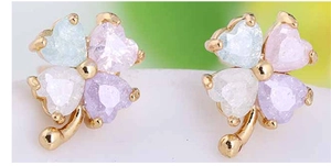 Close-up of 18K gold plated clover stud earrings with colorful heart-shaped gemstones