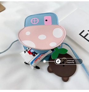 Detailed interior capacity of small blue cartoon crossbody bag for girls showing storage space
