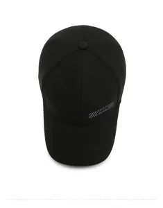 Top down view of black cotton baseball cap showing 6-panel structure and striped logo