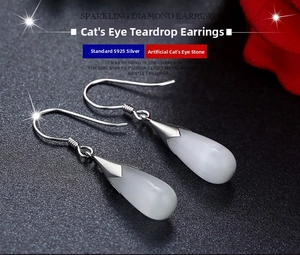 Macro shot of S925 sterling silver moonstone teardrop earrings with elegant ear hooks