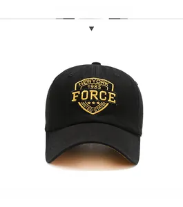 Close-up of yellow 1985 Force embroidery on black cotton twill baseball cap