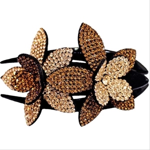Elegant flower hair clip with sparkling champagne rhinestones in a multilayered floral design