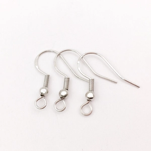 Detailed macro view of S925 sterling silver earring hooks for DIY jewelry making