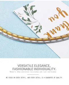 Detailed view of silver and gold cross pattern stainless steel chain bracelets