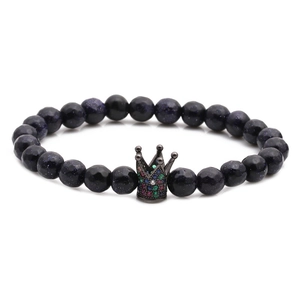 Blue sandstone beaded bracelet with a black crown charm and micro-inlaid colored zircons