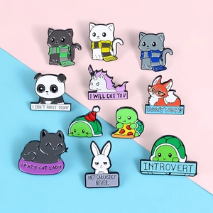 Set of colorful enamel animal pins with humorous quotes like I WILL CUT YOU and INTROVERT