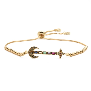Adjustable gold star and moon bracelet with multicolored cubic zirconia crystals