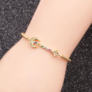 Adjustable gold bracelet with moon and star charms and multicolor cubic zirconia stones