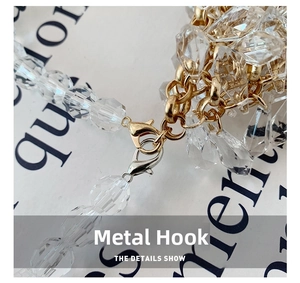 Detail view of gold and silver metal lobster clasps with faceted crystal bead chains