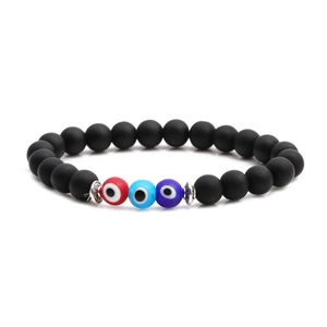 Matte black beaded elastic bracelet with colorful evil eye beads and silver spacers