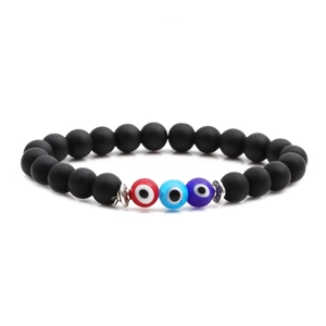 Elastic beaded bracelet with matte black stones and three colorful evil eye charms
