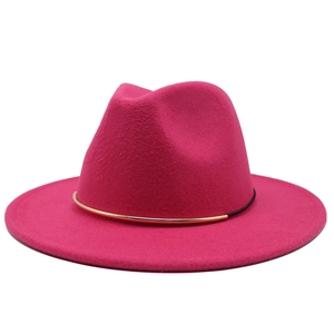 Detail of rose pink wool fedora hat featuring minimalist gold metal tube decoration