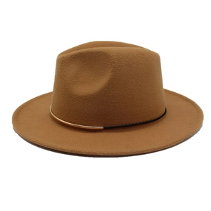 Detail of camel wool fedora hat featuring black cord band and gold metal hardware