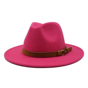 Detail view of rose red wool fedora hat with brown leather belt and gold metal buckle