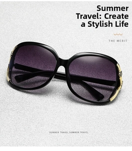 Detail of polarized oversized sunglasses with gold floral hinge and gradient lens