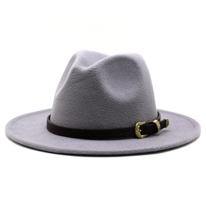 Detail of greyish purple wool fedora hat with brown leather band and gold buckle