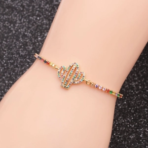 Adjustable copper bracelet featuring a cactus charm with colorful zircon stones in gold