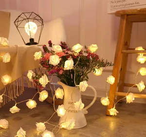 Close-up of warm yellow LED rose string lights for romantic home and wedding decor