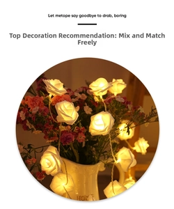 Warm yellow rose LED string lights wrapped around a white flower vase for home decor