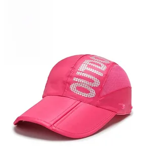 Detail view of pink outdoor sun hat featuring side mesh vents and outdoor lettering