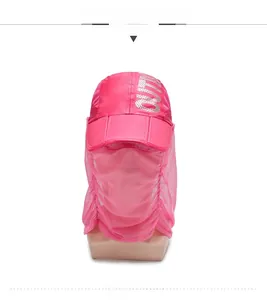 Close-up of pink sun hat with breathable mesh face cover and outdoor silver logo