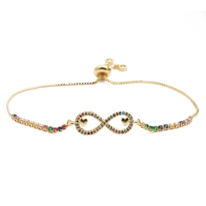 Golden infinity bracelet with colorful zircon stones and heart charms on white background