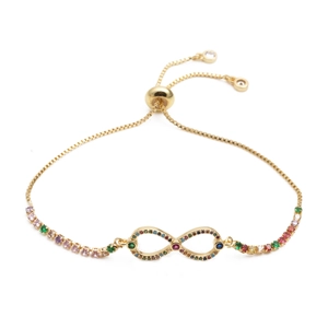 Macro detail of adjustable infinity bracelet with colorful zircon stones in gold finish