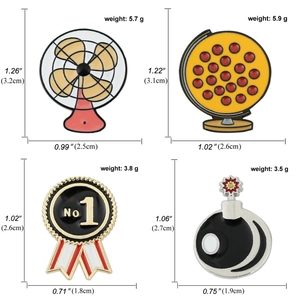 Set of enamel pins featuring fan globe and bomb designs with size and weight specs