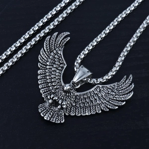 Vintage stainless steel eagle pendant necklace with intricate wing detail and box chain
