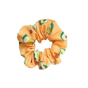 Orange avocado print silk scrunchie with vibrant pattern and elastic hair band