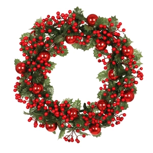 Artificial Christmas wreath with green holly leaves, red berries, and glossy ornaments