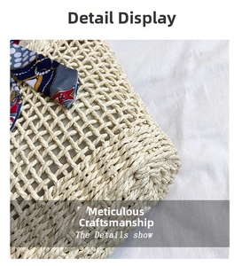 Close-up of woven straw bag texture featuring a decorative printed silk scarf tied on the side